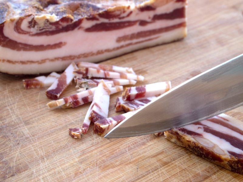 Cutting smoked bacon
